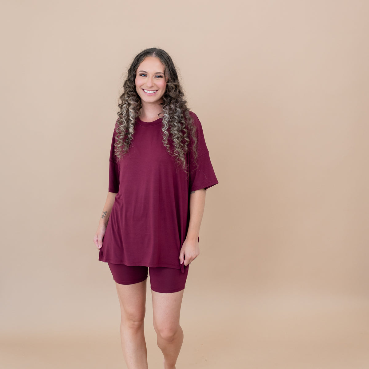 Female model wearing the Women’s Biker Short Set in Burgundy
