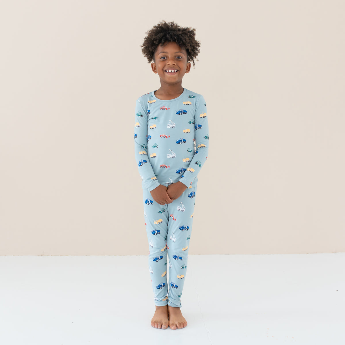 Child modeling Long Sleeve Pajamas in Construction