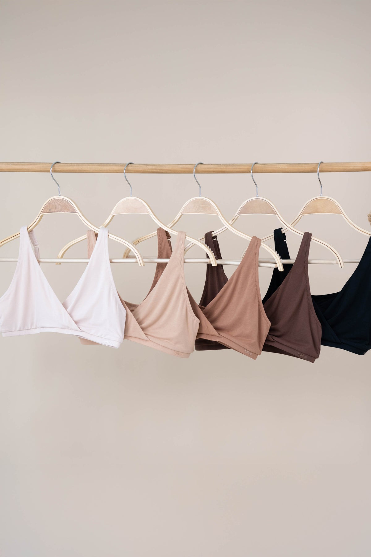 Women's Cross Front Bralette in Neutral colors on hangers