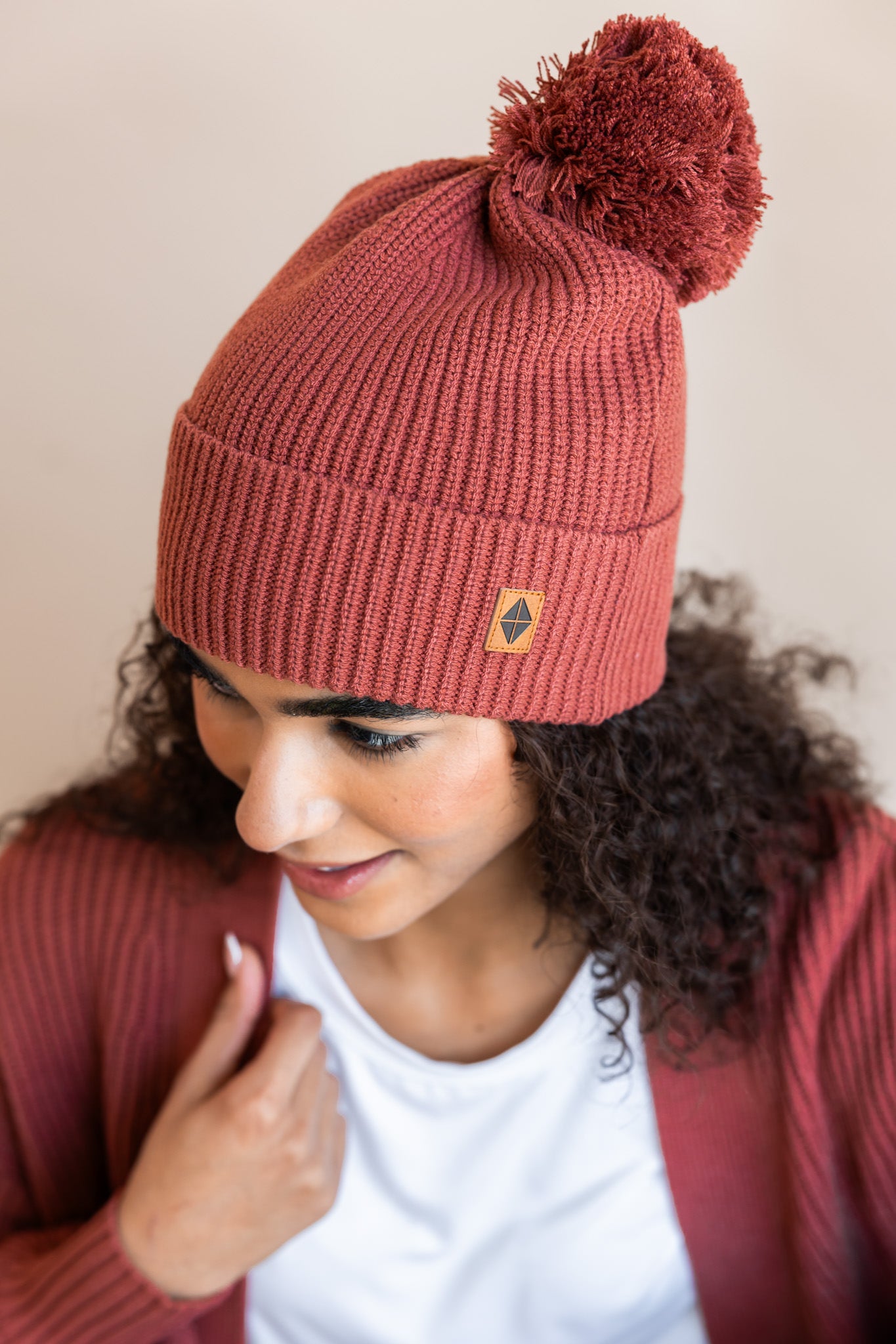 Modal wearing Chunky Knit Adult Pom in Ember