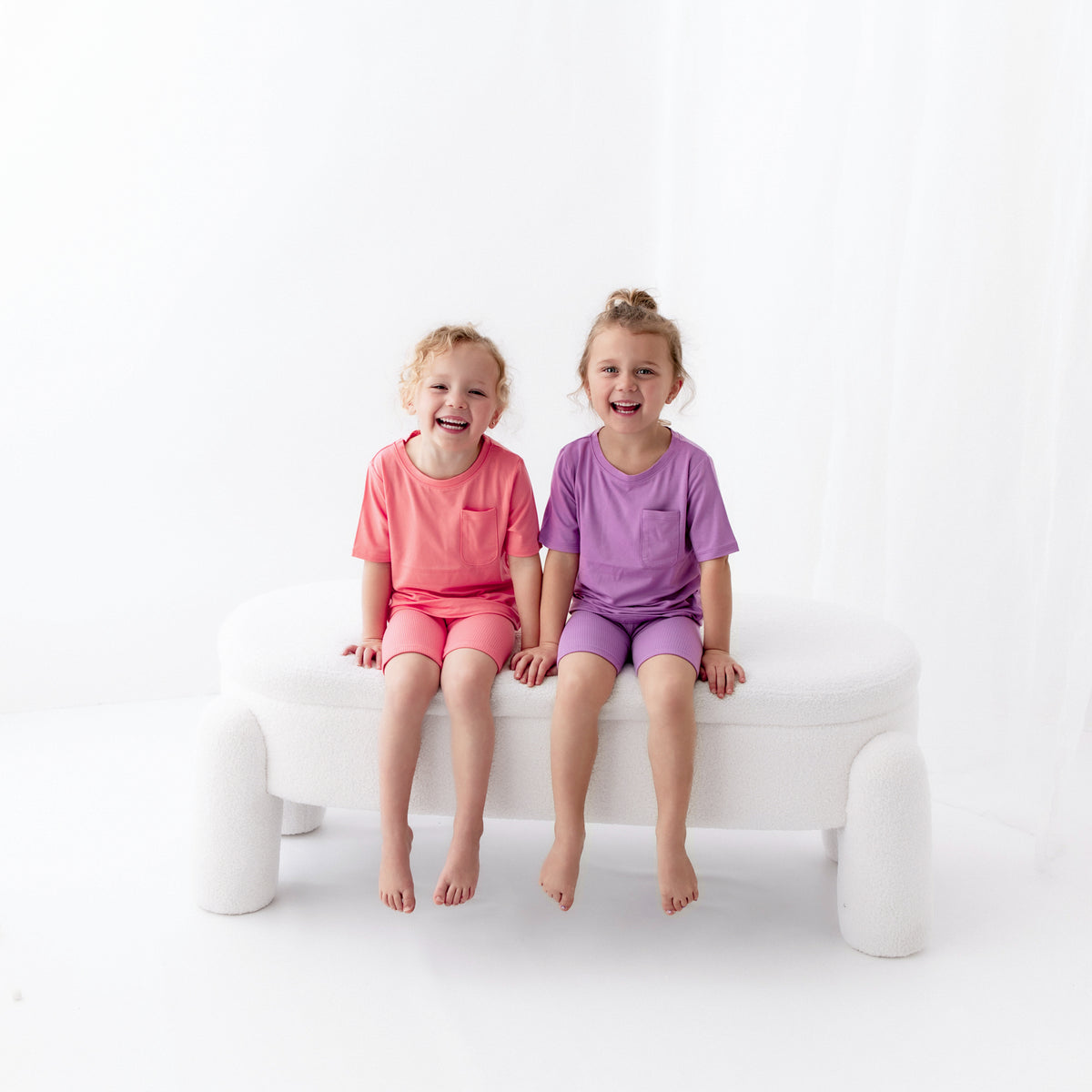 Kids wearing Toddler Crew Neck Tees in Guava and Poi with matching ribbed shorts