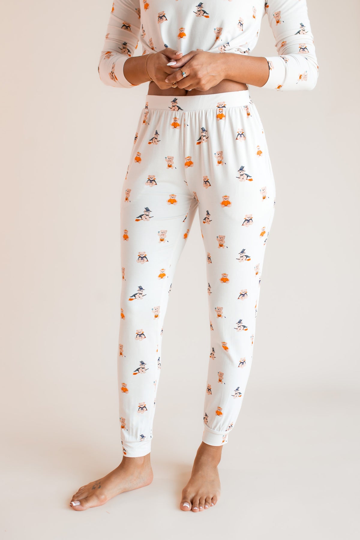 Modal showcasing jogger pajama of Women's Jogger Pajama Set in Halloween Teddy print on a beige background