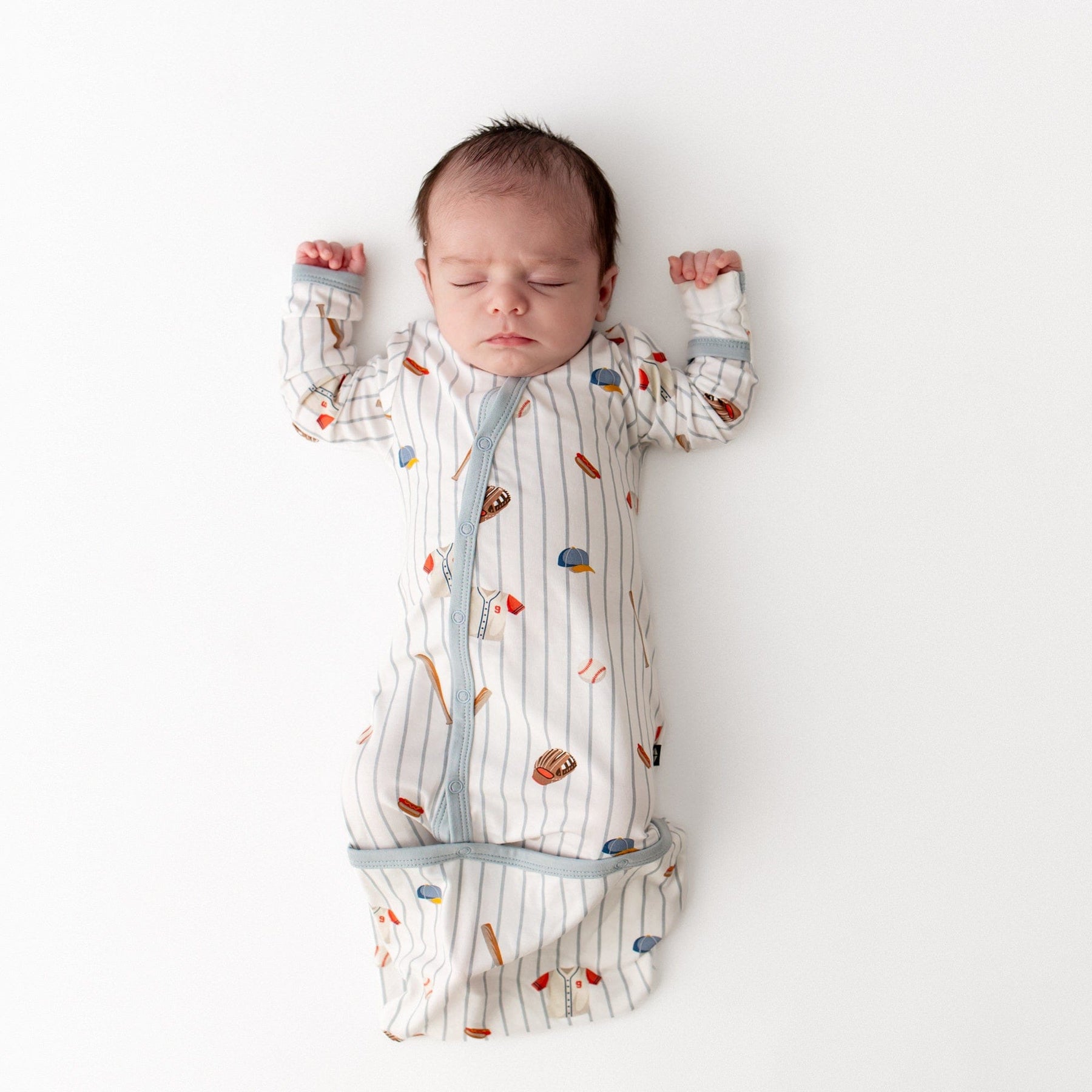 Sleeping infant wearing the Bundler in Home Run