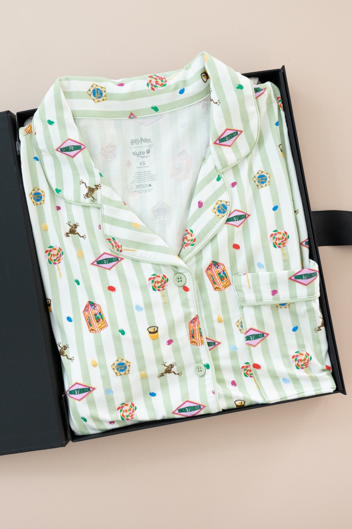 Women's Short Sleeve Pajama Set in Honeydukes print packed in a box on a beige background