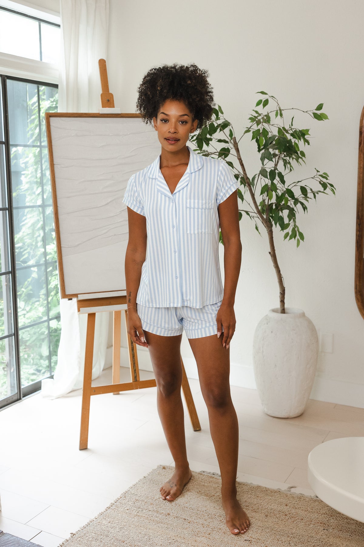 Female modeling the Women's Short Sleeve Pajama Set in Small Mist Stripe in a living room