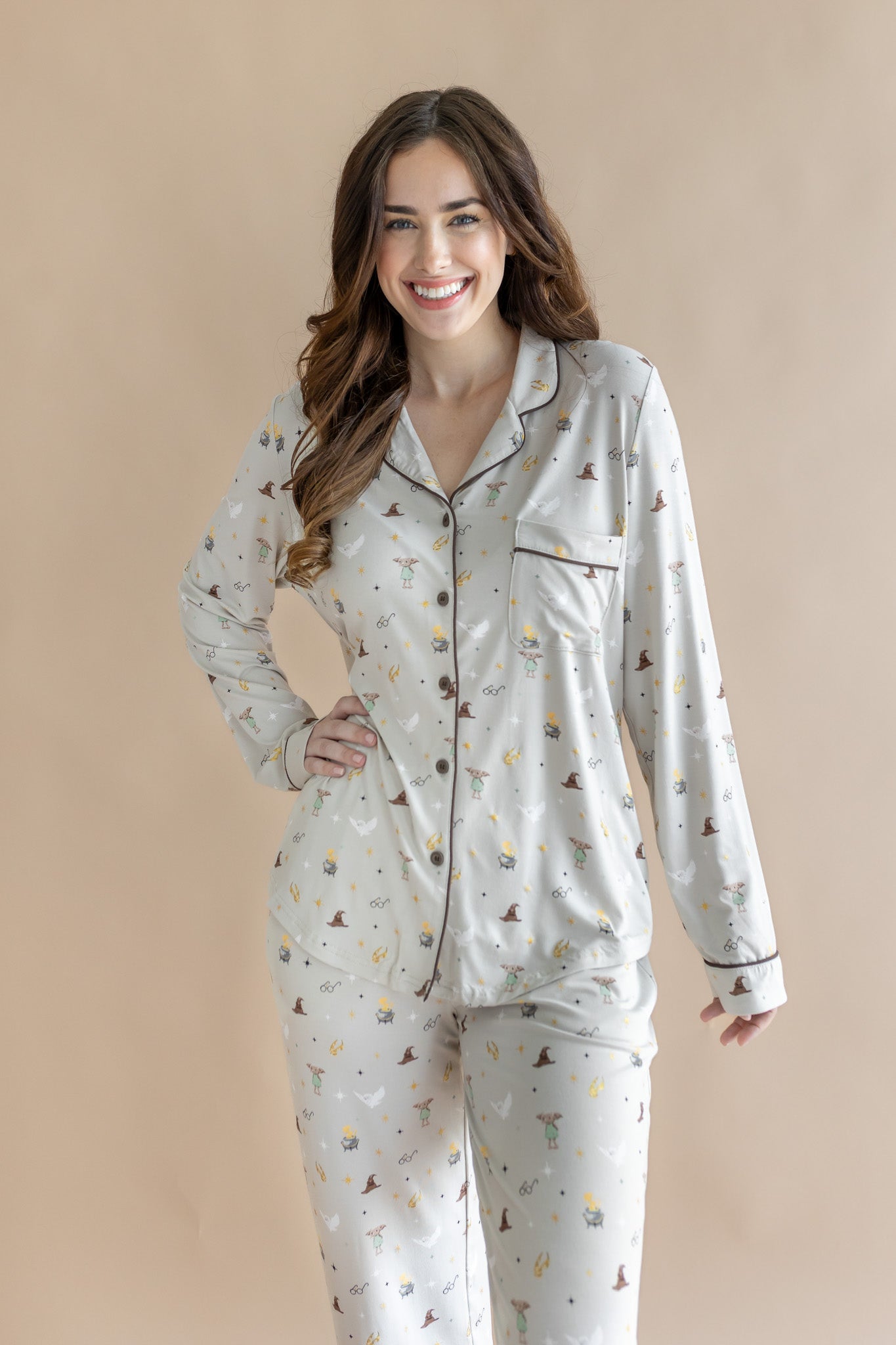 Model wearing a cream Long-Sleeved Women's Pajama Set with Harry Potter prints on a beige background