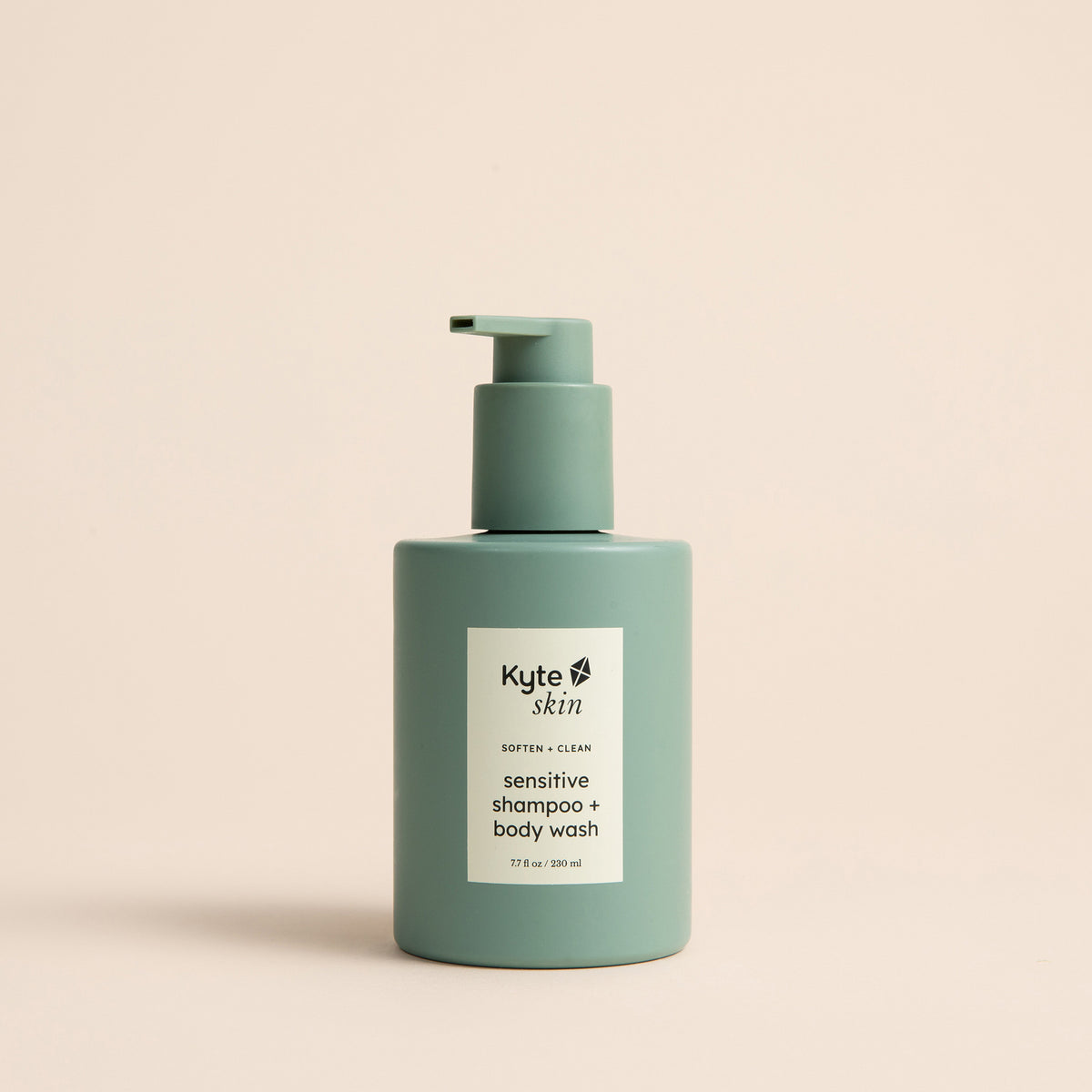 Green shampoo and body wash bottle with Kyte Skin label on a beige background