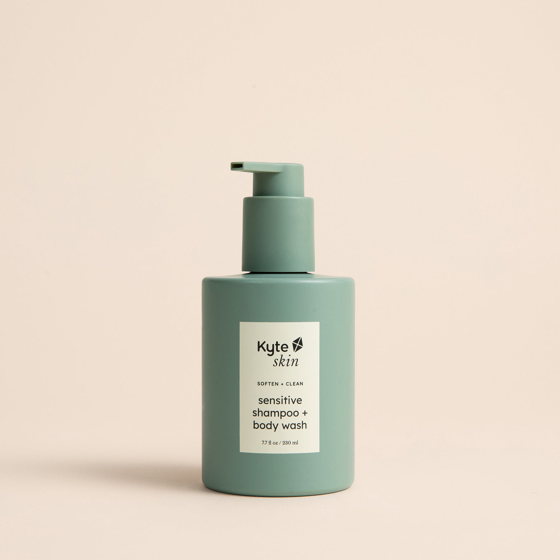 Green shampoo and body wash bottle with Kyte Skin label on a beige background
