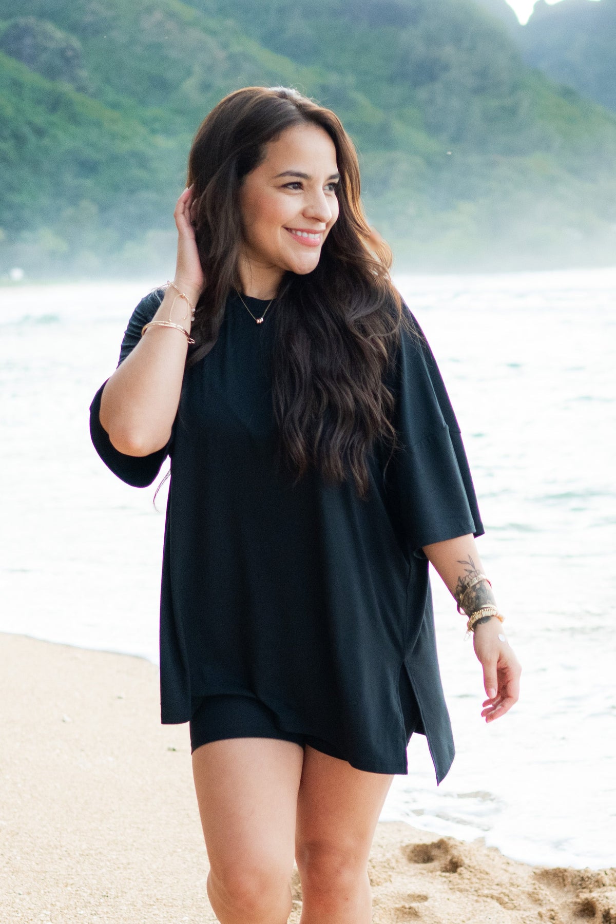 Woman modeling Women’s Biker Short Set in Midnight on beach