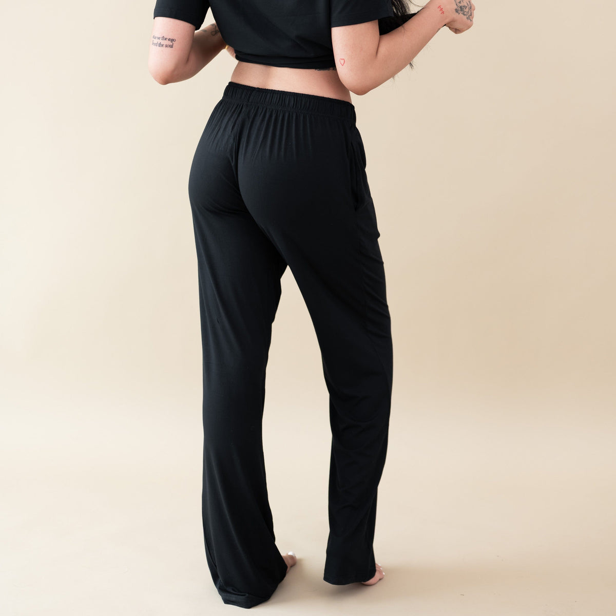 Woman modeling Women's Lounge Pants in Midnight and v-neck