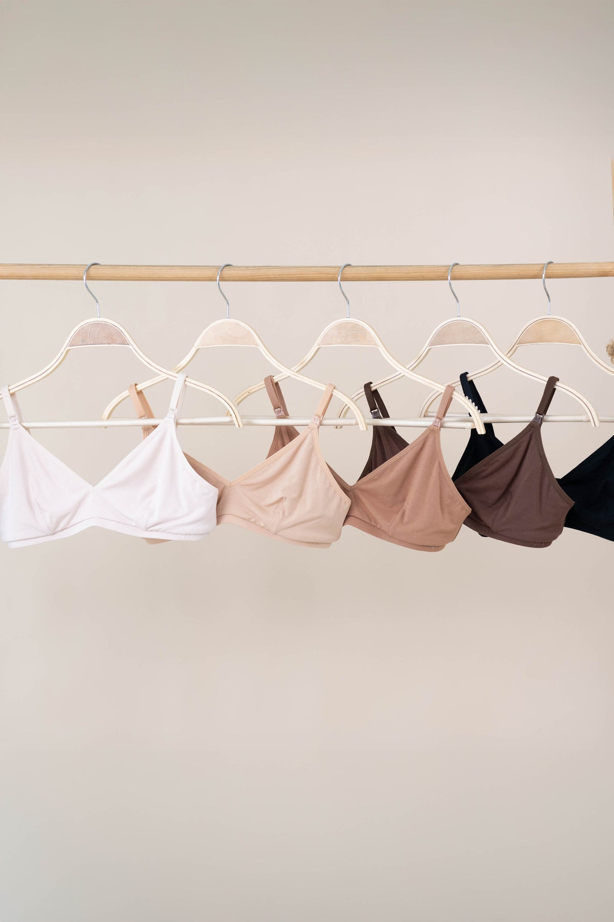 Women's Nursing Bra in Neutrals hanging on a hanger