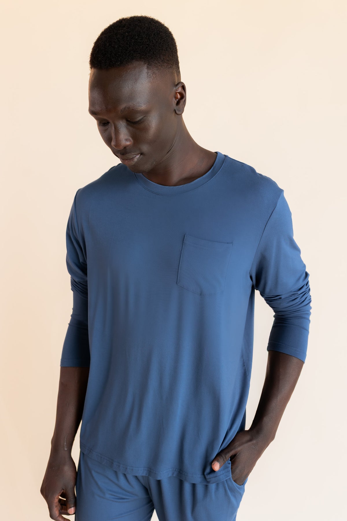 Close up of Model wearing Men's Jogger Set in Oxford on a beige background