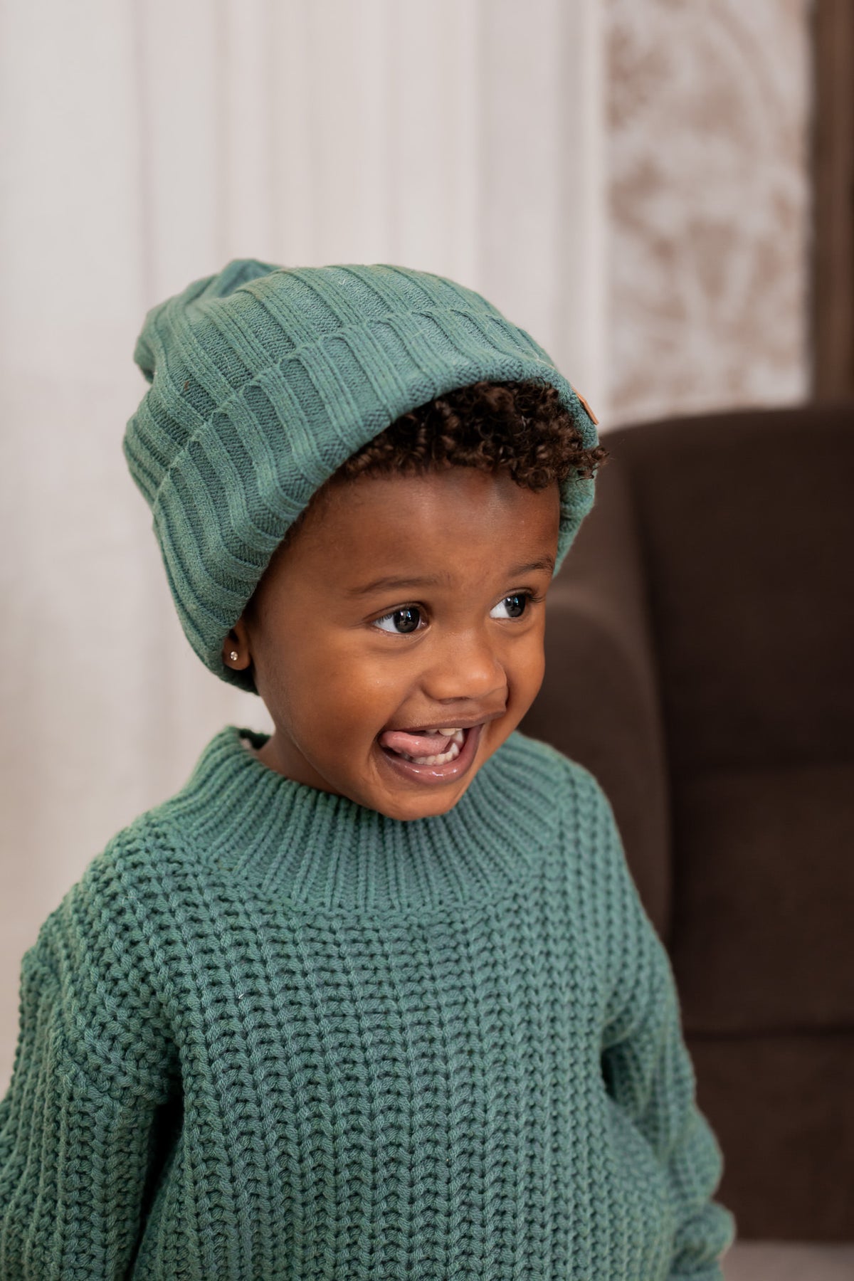 Boy wearing Chunky knit sweater with chunky knit ribbed beanie in Pine