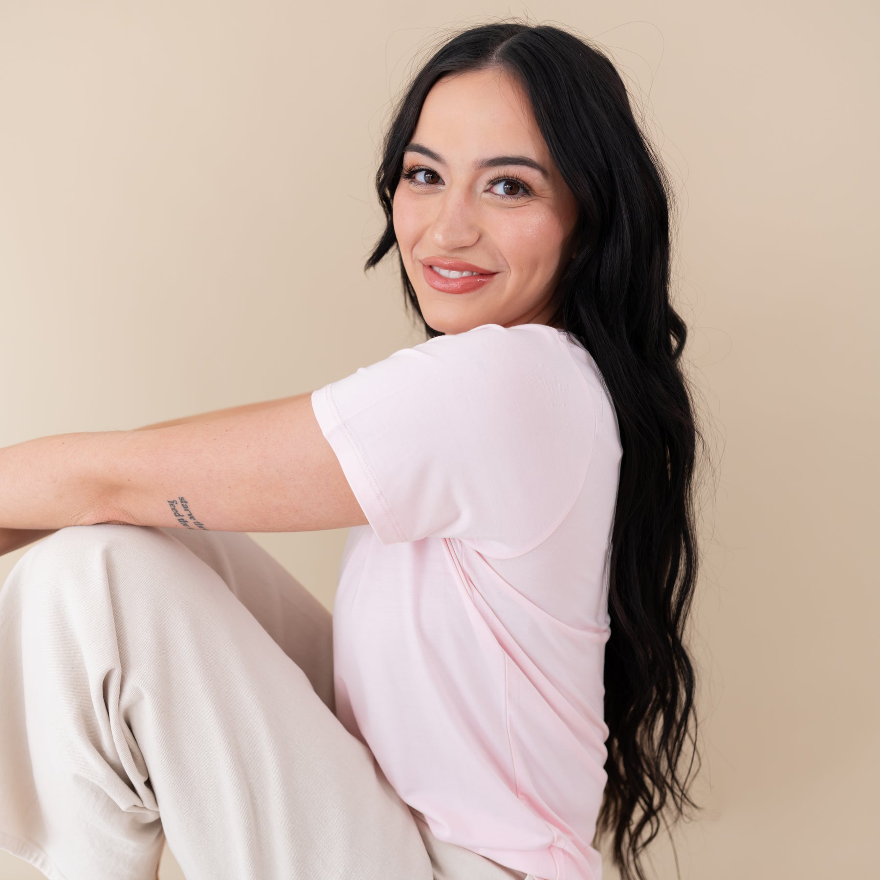 Woman modeling Women's Crew Neck Tee in Sakura close up