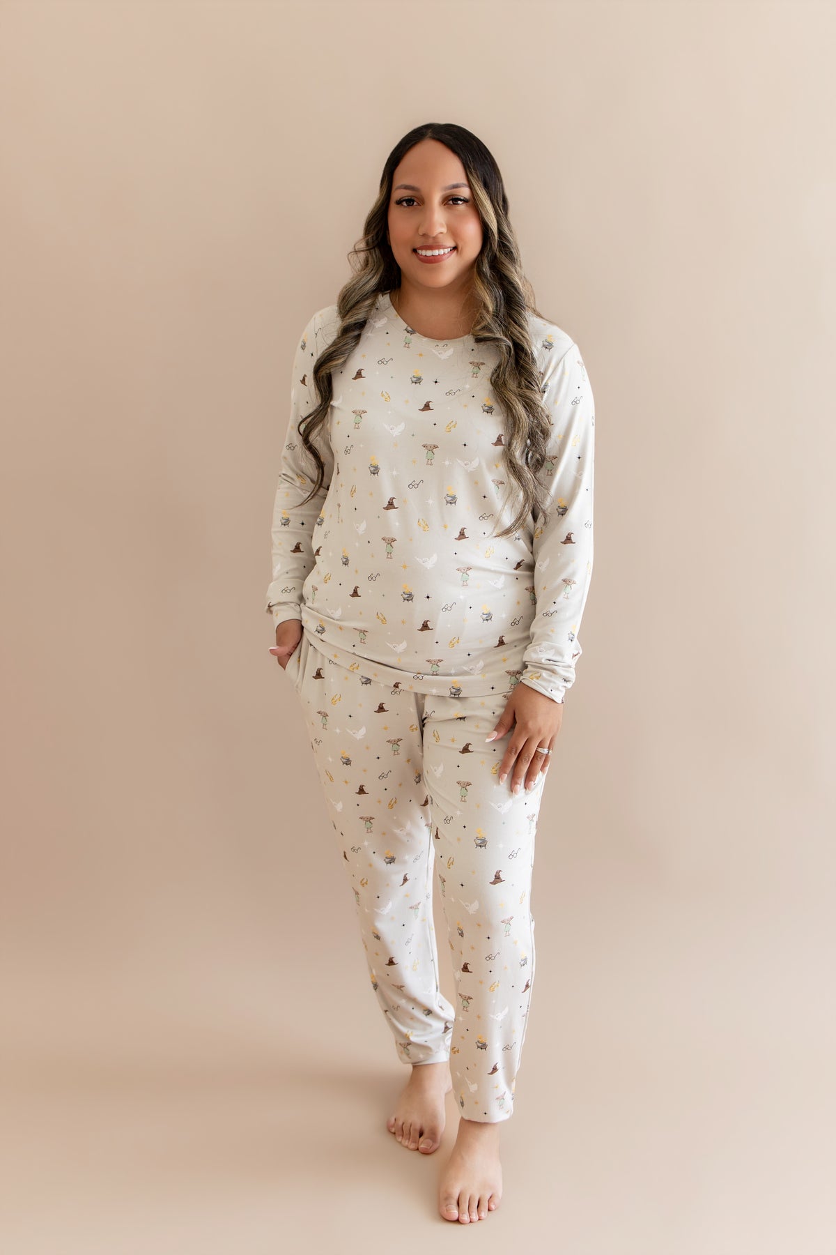 Women wearing a cream joggers set with Harry Potter prints on a beige background