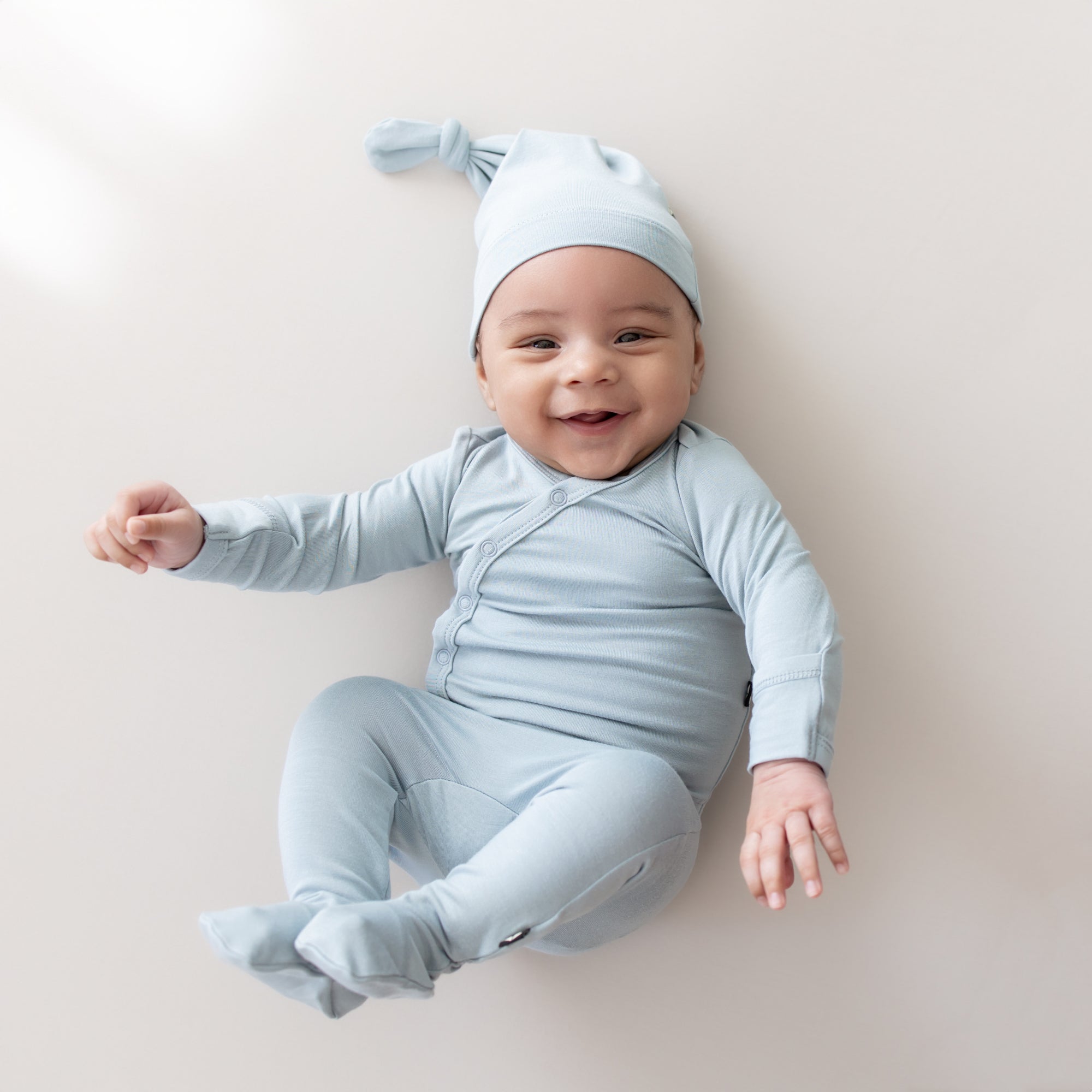 Smiling baby wearing Hospital Take Me Home Set with Cap in Fog 
