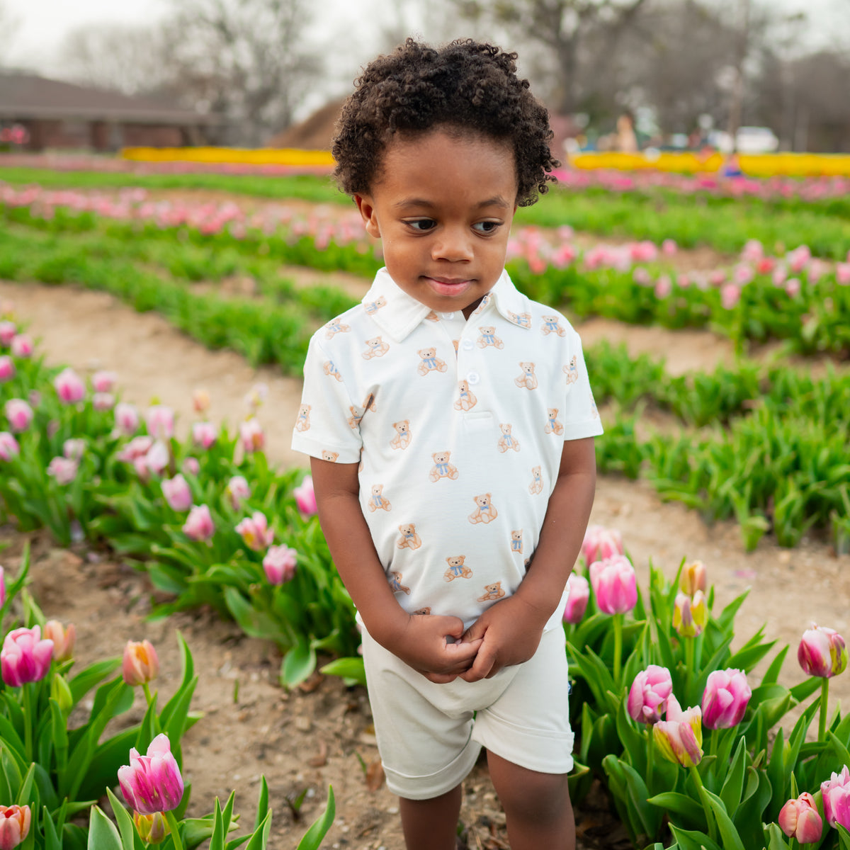 Boy wearing Bamboo Toddler Short Sleeve Polo in Teddy Bear Spring Print