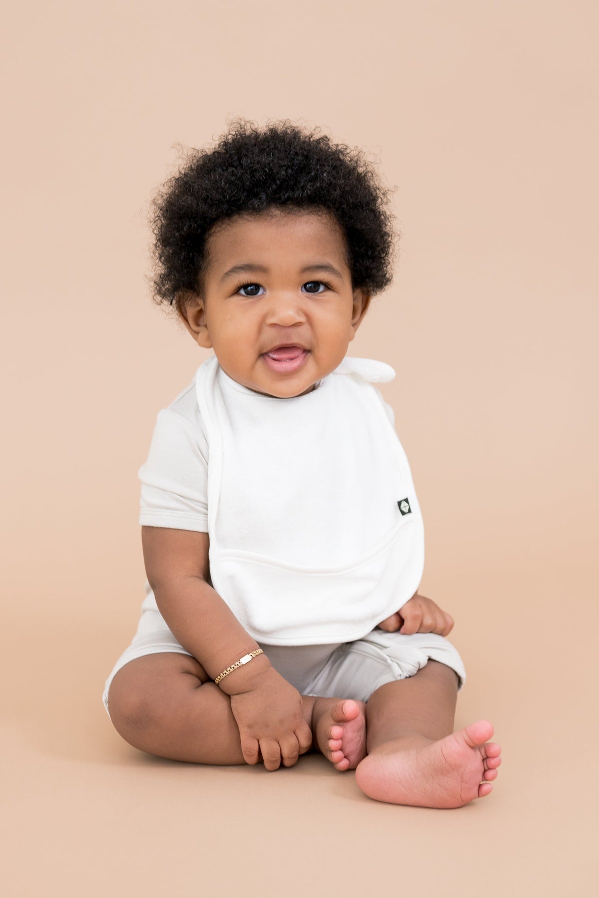 Baby wearing Adjustable White Terry Pocket Bib