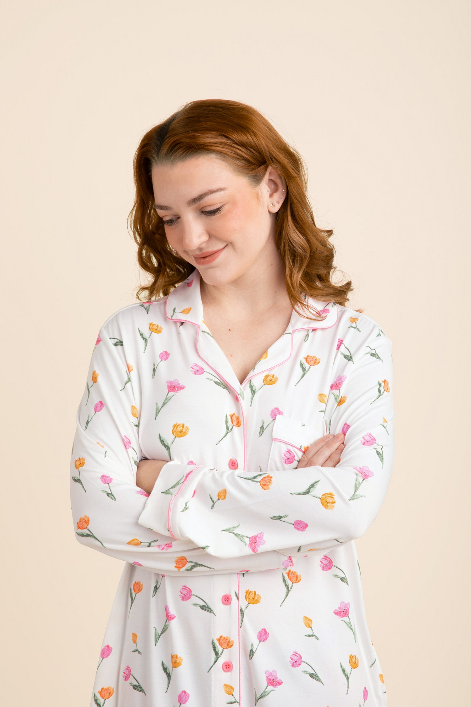 Close up of a female model wearing the Long Sleeve Women’s Nightshirt in Tulip with her arms crossed
