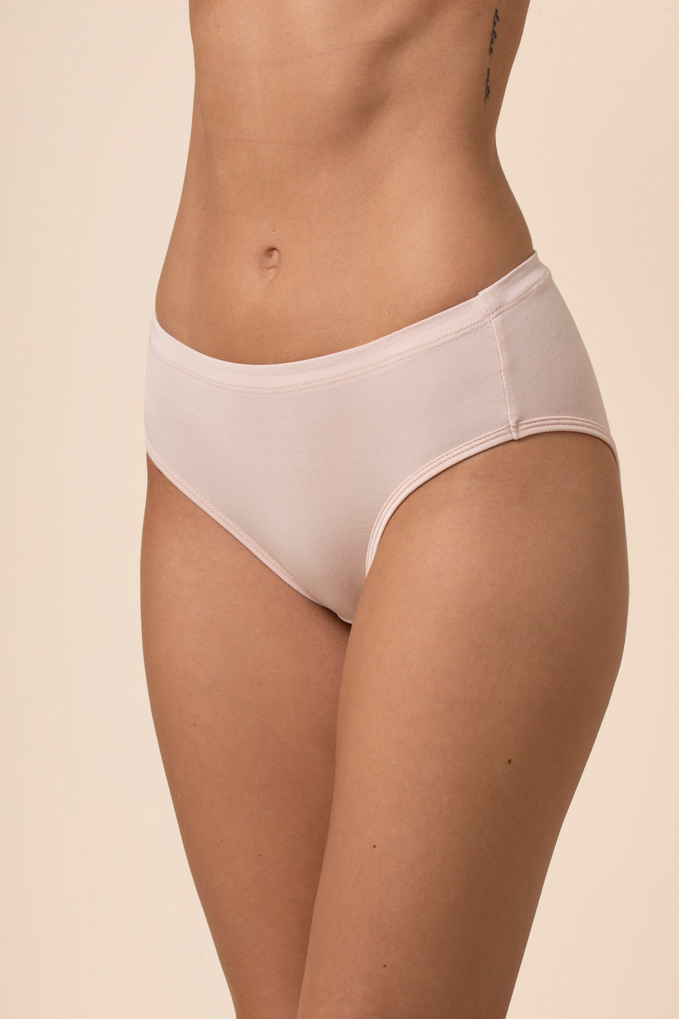 Light pink underwear on a beige background