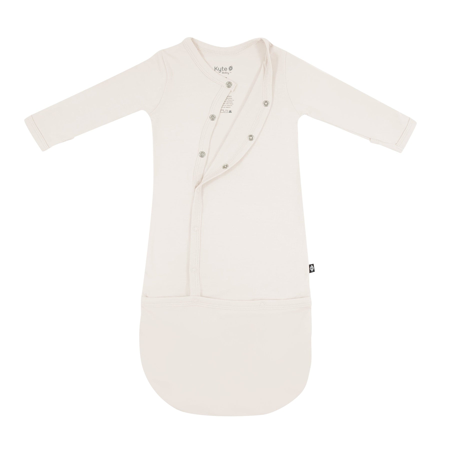 Kyte Baby Snap Bundler in Oat partially unsnapped from the top