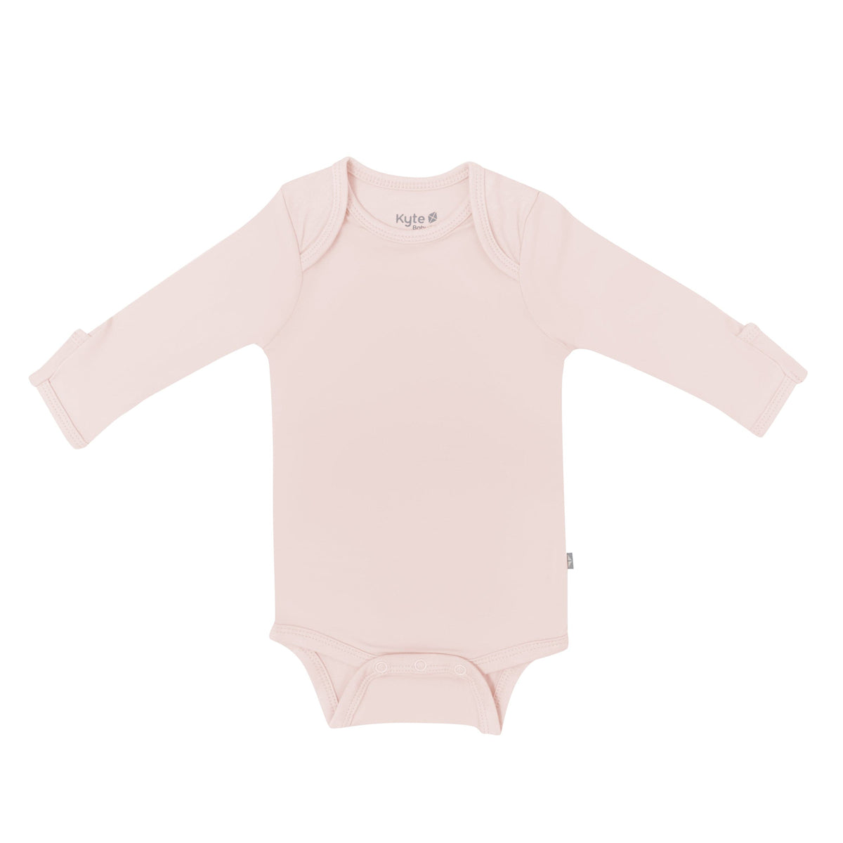 Flat lay of Kyte Baby Long Sleeve Bodysuit in  Blush