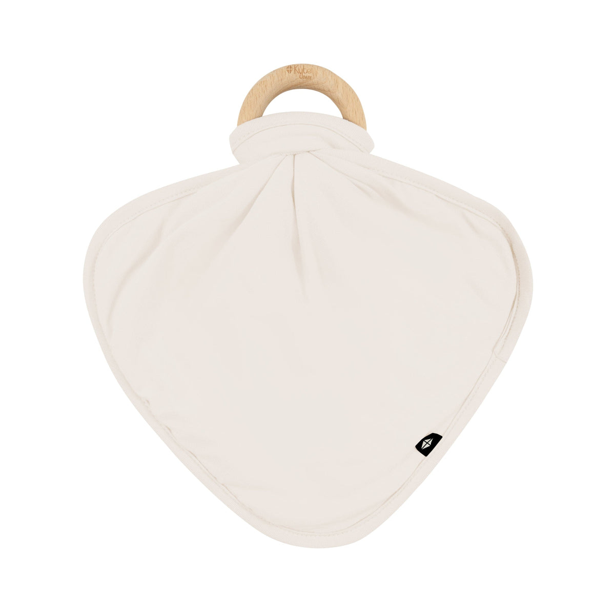 Flat lay of Kyte Baby Lovey in Oat with Removable Wooden Teething Ring