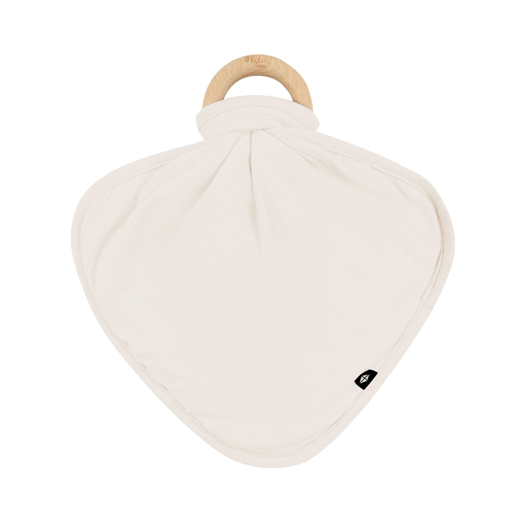 Flat lay of Kyte Baby Lovey in Oat with Removable Wooden Teething Ring