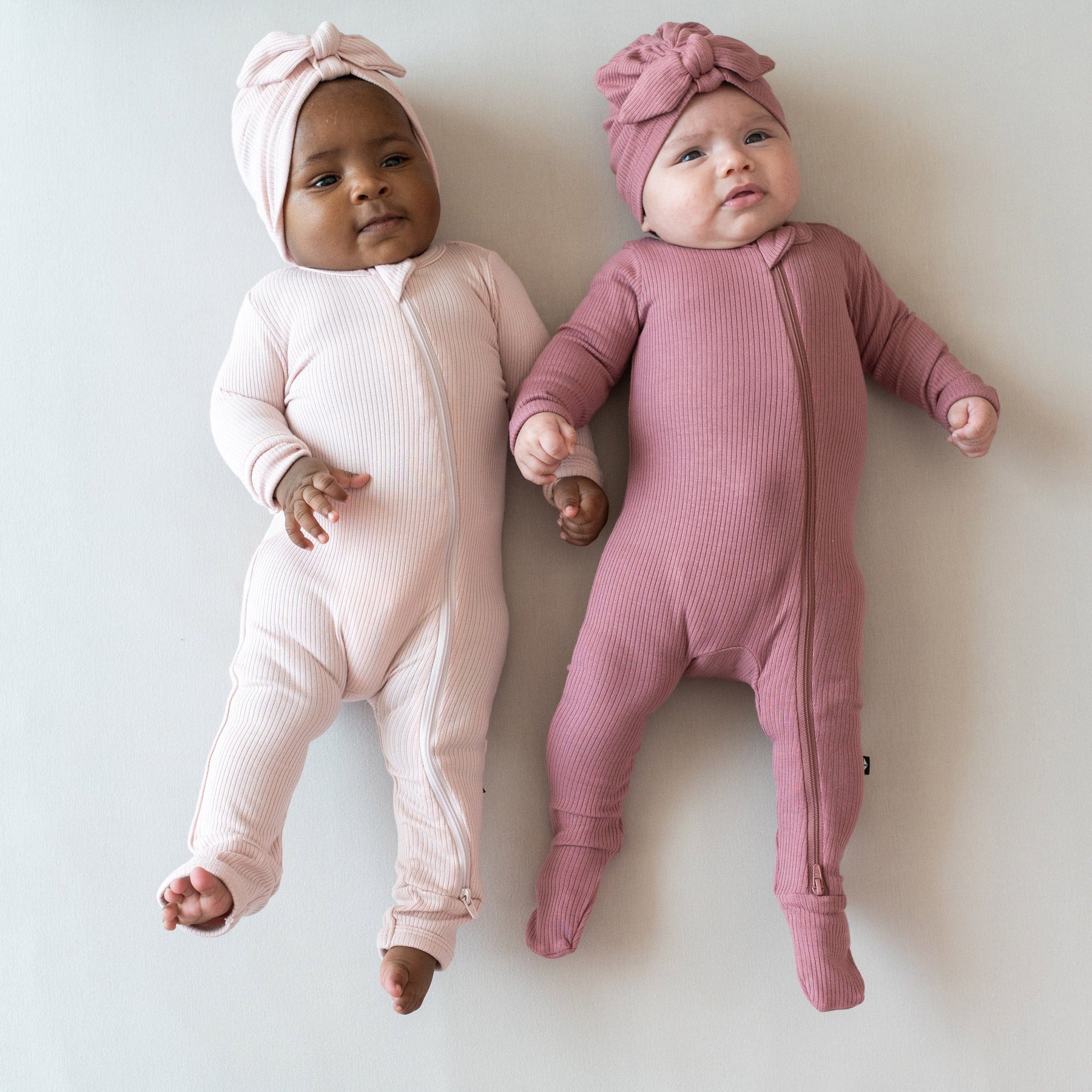 Babies wearing Kyte Baby Ribbed Headwraps with knotted bow