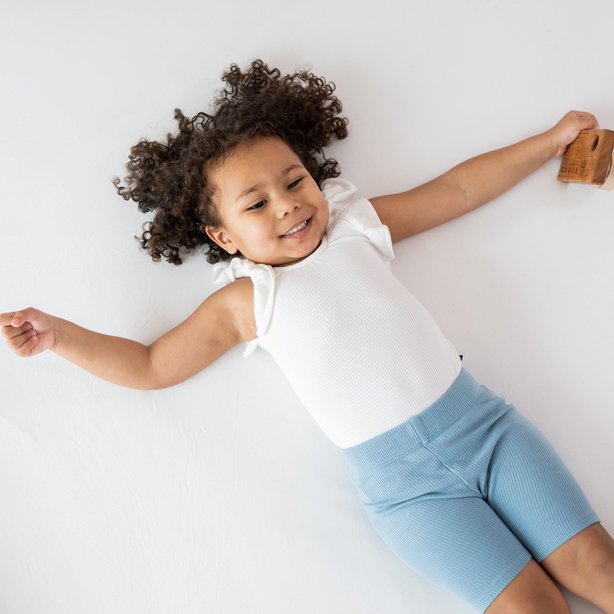 Toddler wearing Ribbed Toddler Biker Shorts in Dusty Blue