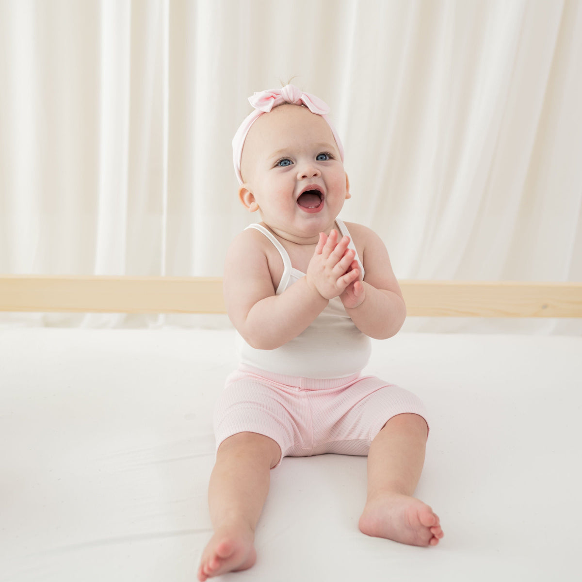 Infant wearing Kyte Baby Ribbed Biker Shorts in Sakura