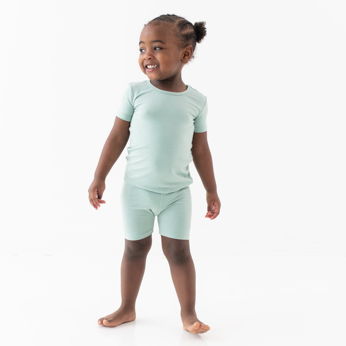 Toddler wearing Short Sleeve Kids Pajama Set in Sage