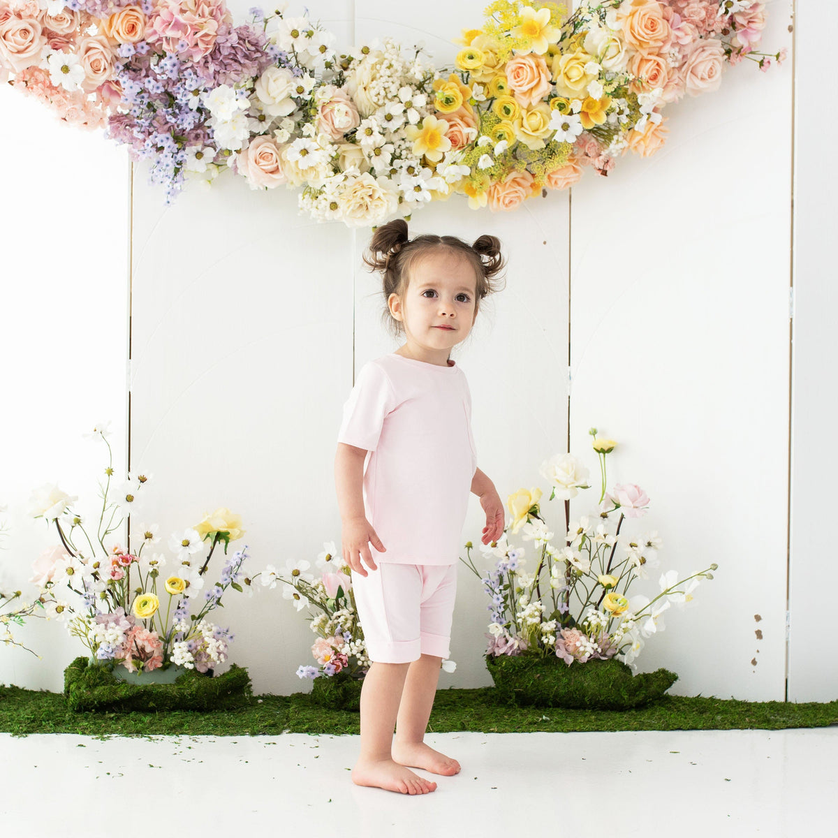 Girl wearing Kyte Baby Toddler Crew Neck Tee in Sakura