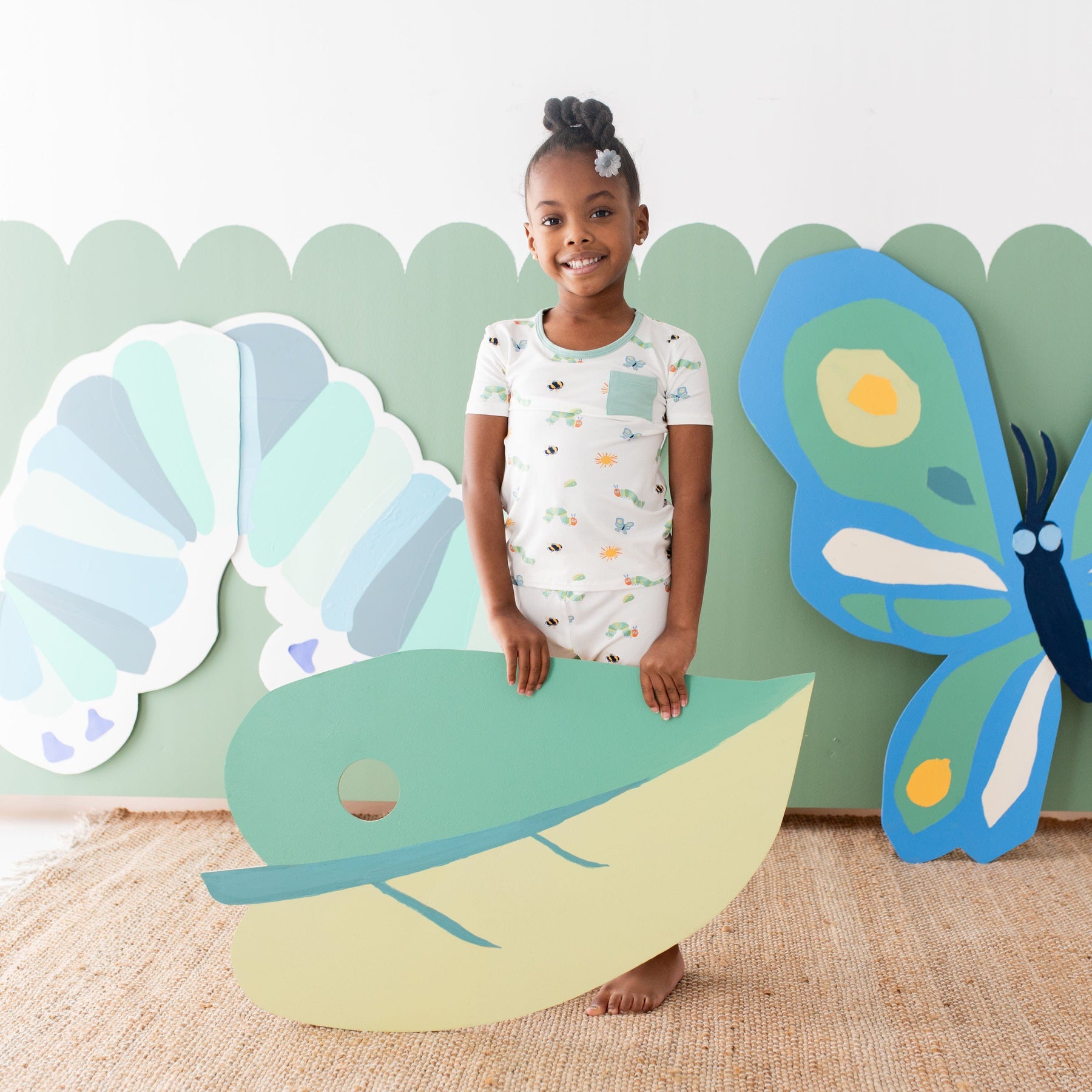 Girl wearing Short Sleeve and Pants Kids Pajamas in The Very Hungry Caterpillar™ and Friends