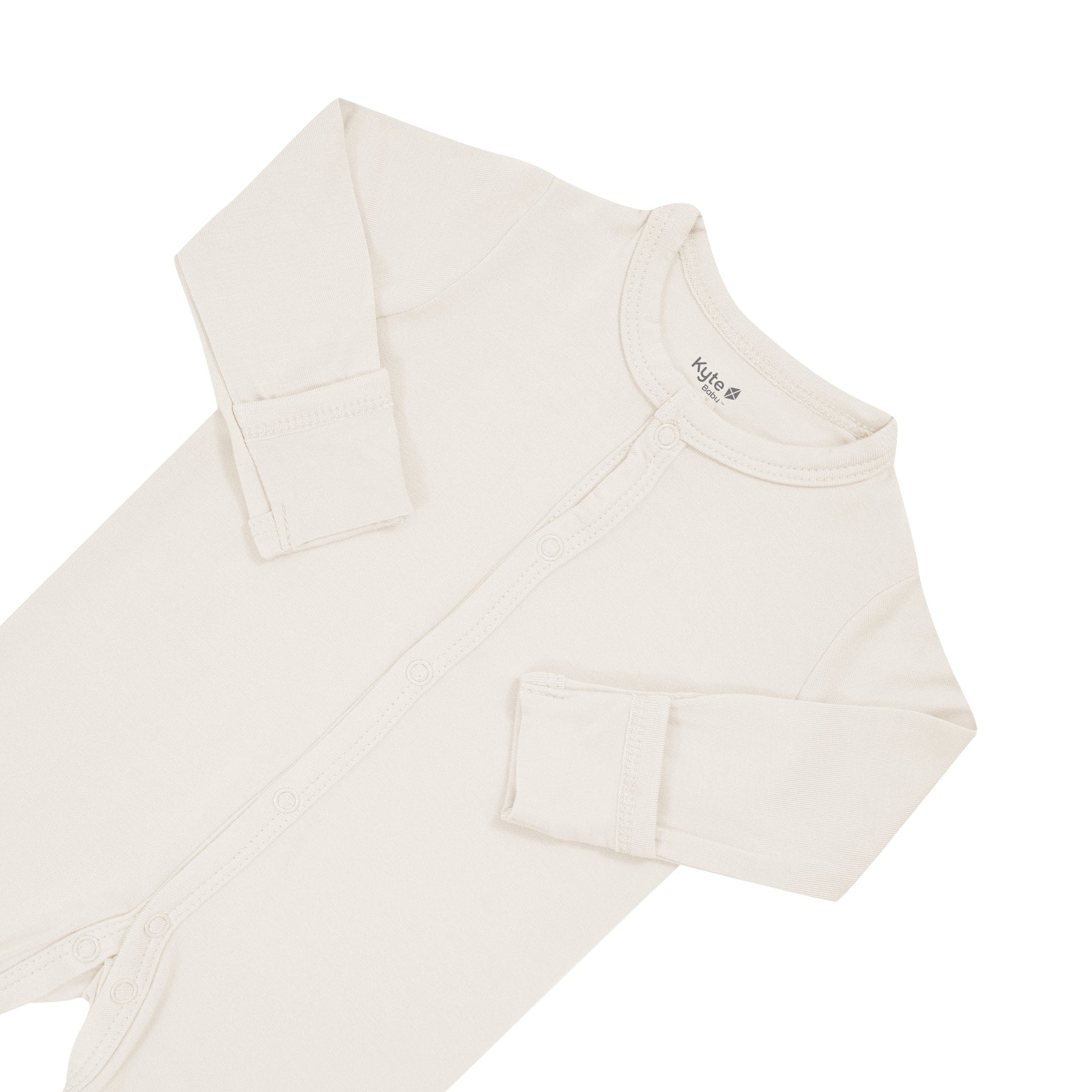 Fold over cuffs on Kyte Baby snap Footie in Oat
