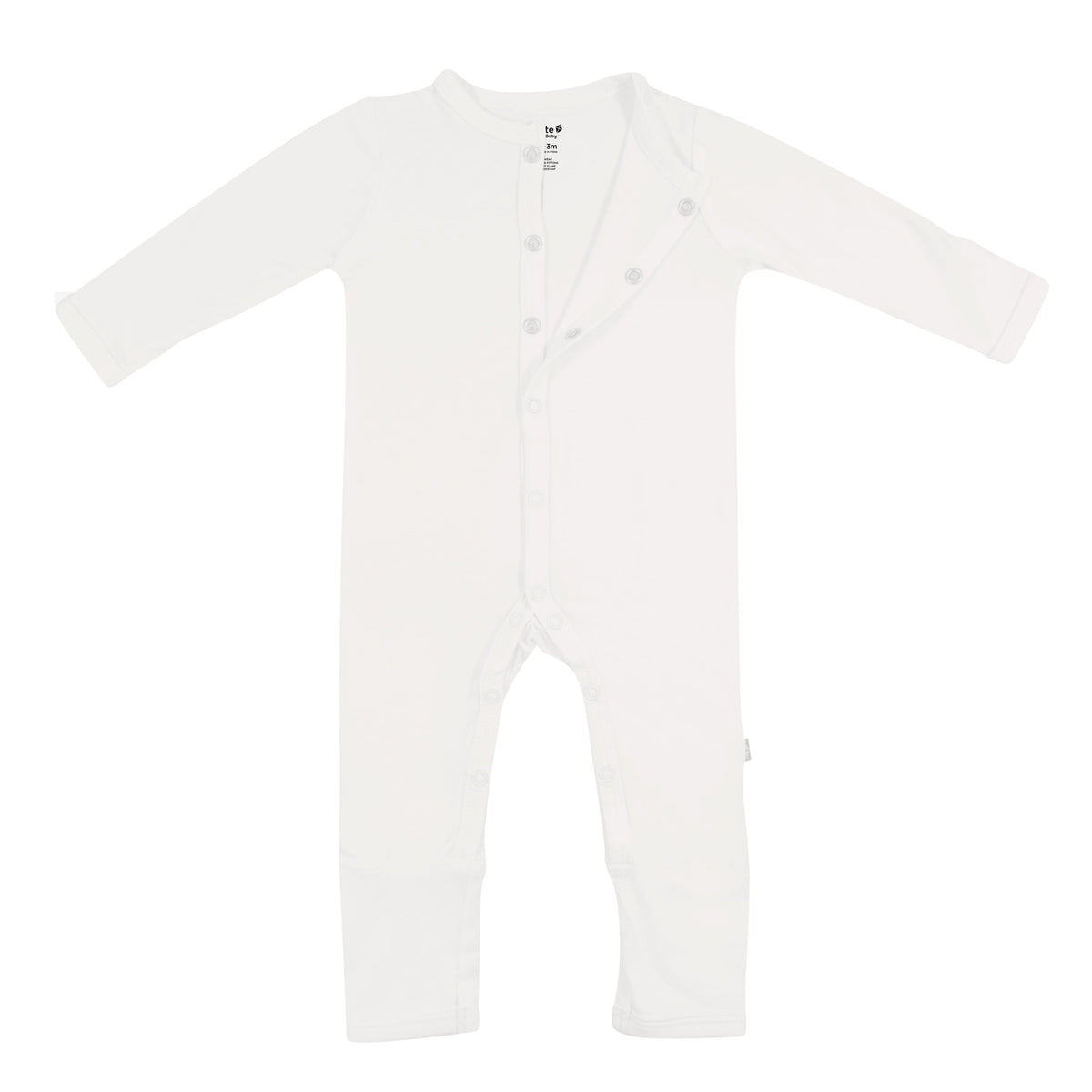 Flat lay of Kyte Baby long sleeve Romper in Cloud with top snaps opened