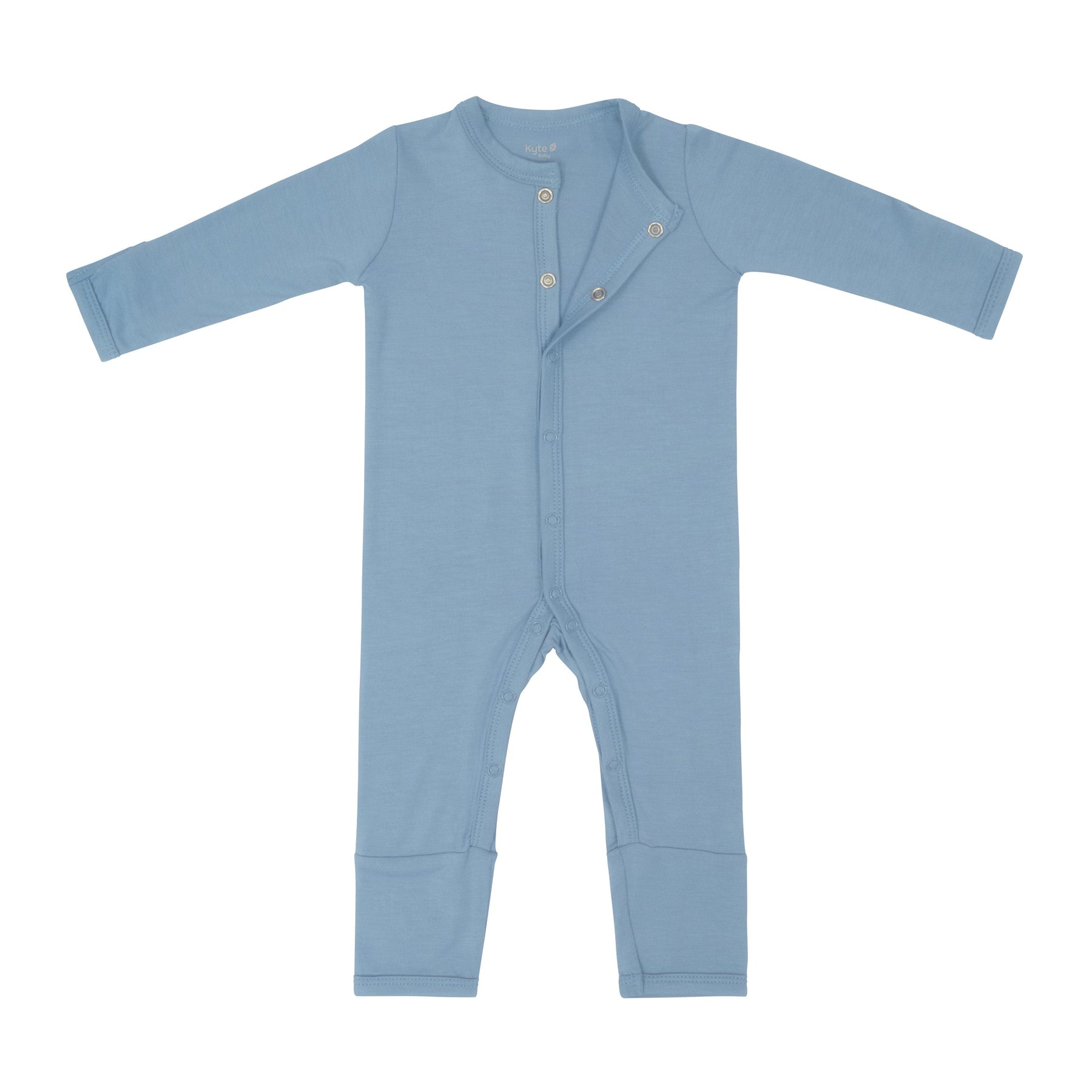 Flat lay of Kyte Baby Romper in Slate with snaps opened from the top