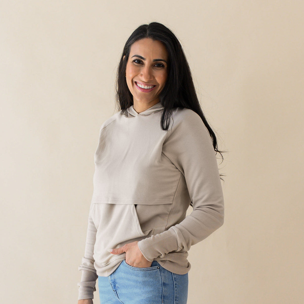 Woman wearing Kyte Baby Women's French Terry Bamboo Nursing Hoodie with Kangaroo Pocket in Almond