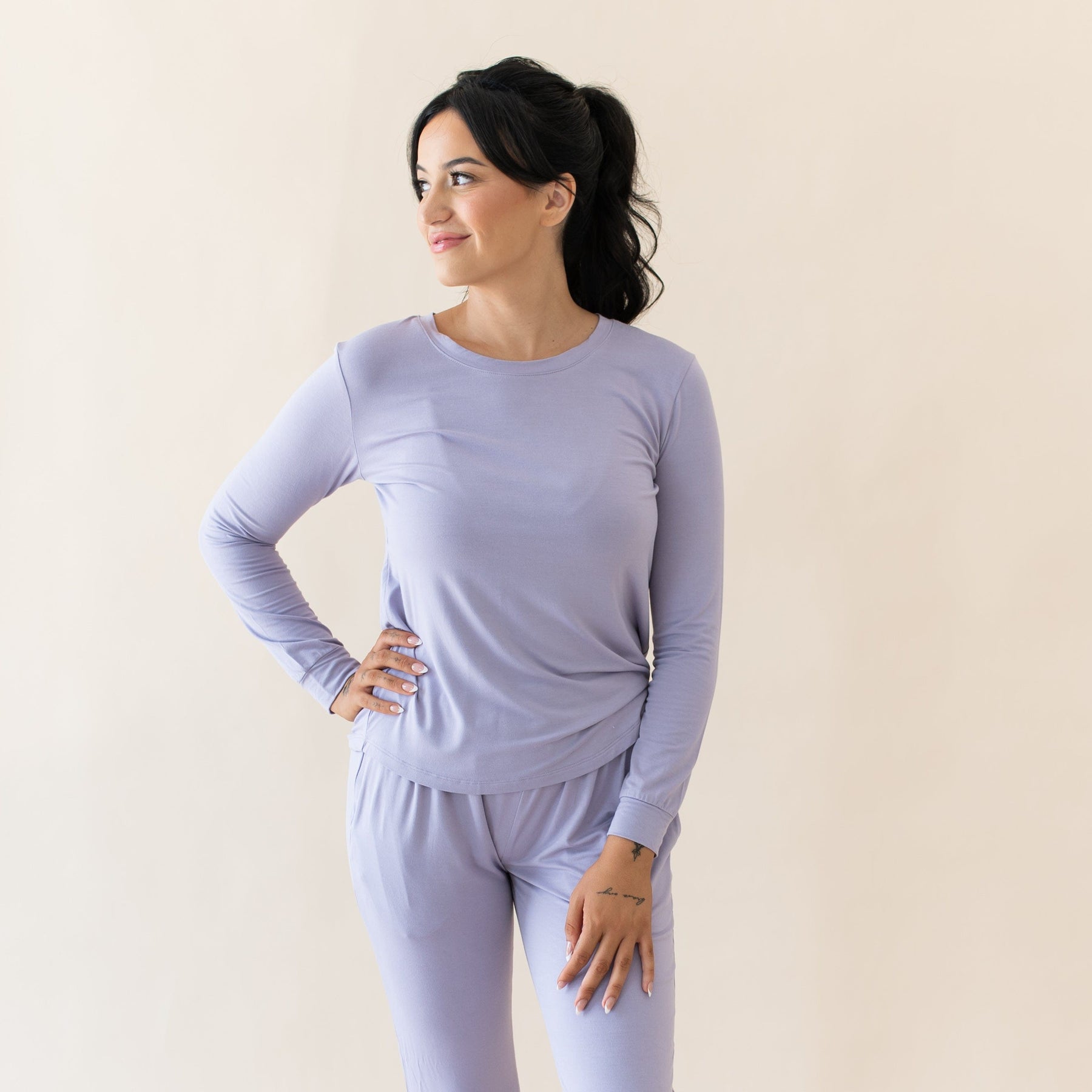 Woman wearing purple Women's Long Sleeve Jogger Pajama Set 