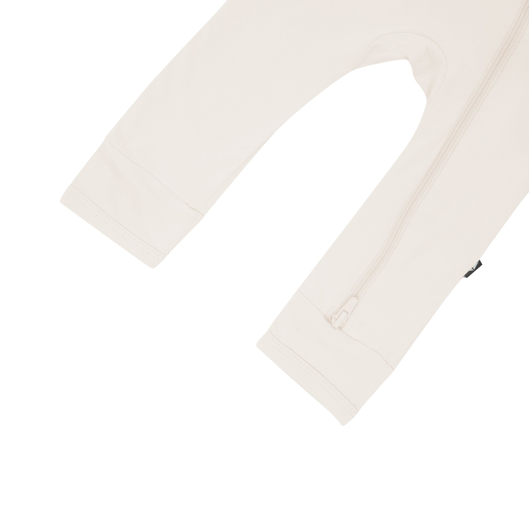 Close up of open feet on Kyte Baby Zippered Romper in Oat