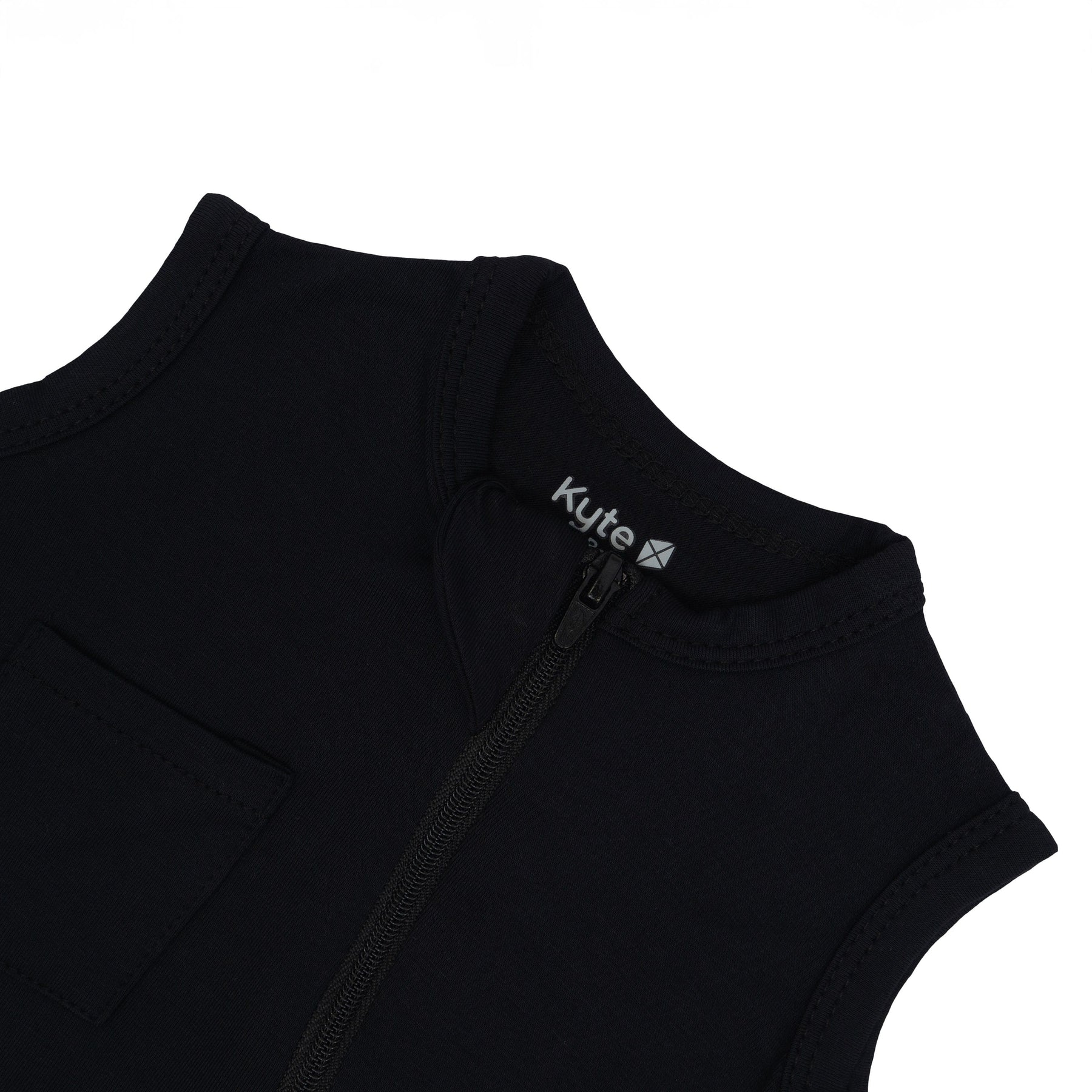 Close up of zipper garage on  Kyte Baby Zippered Sleeveless Romper in Midnight