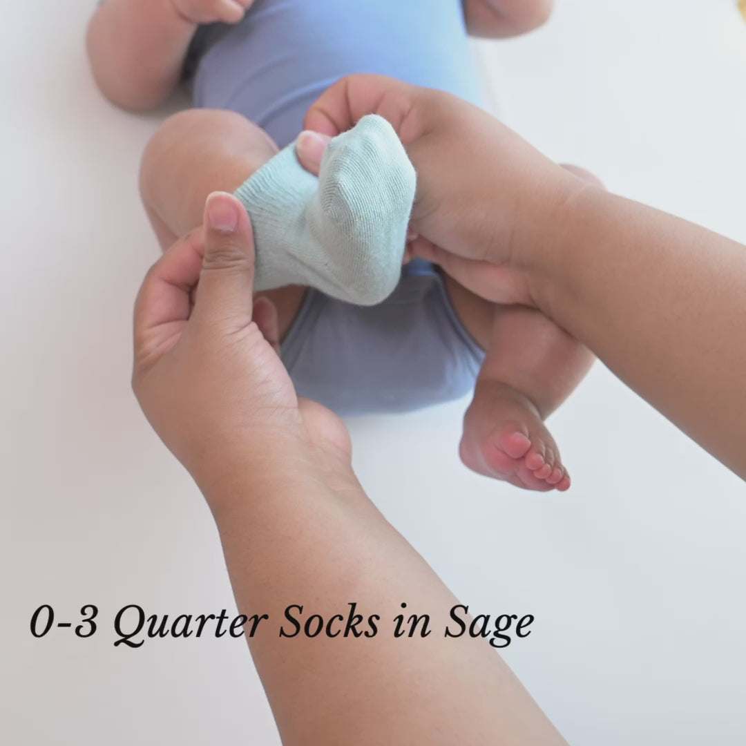 Video of parent putting Kyte Baby Quarter Length Socks on Newborn