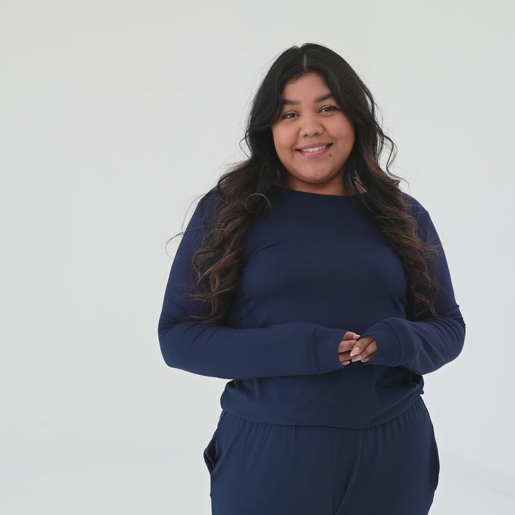 Video of woman wearing Kyte Baby women's jogger pajama set in Navy