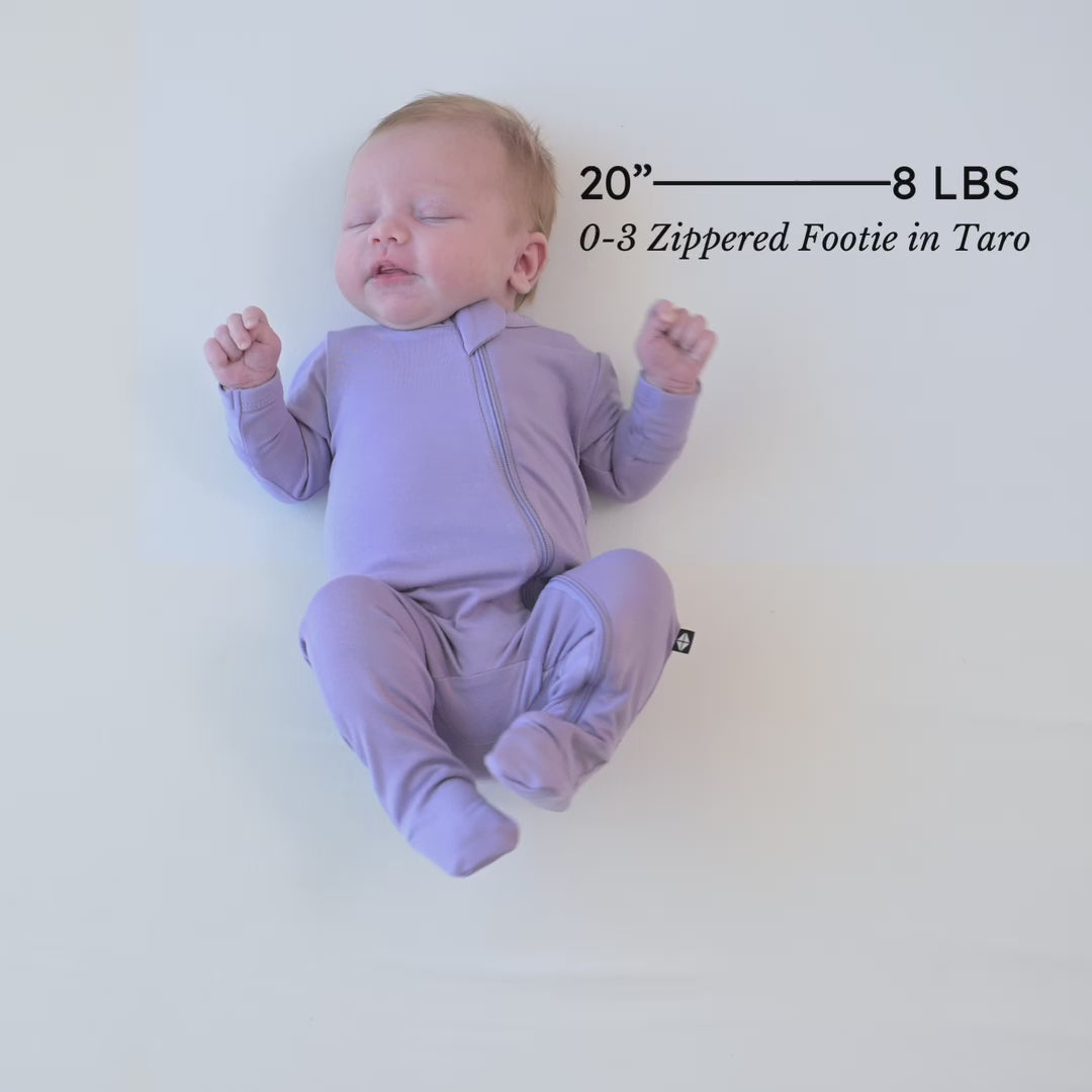 Video of infant model wearing the Zippered Footie in Taro