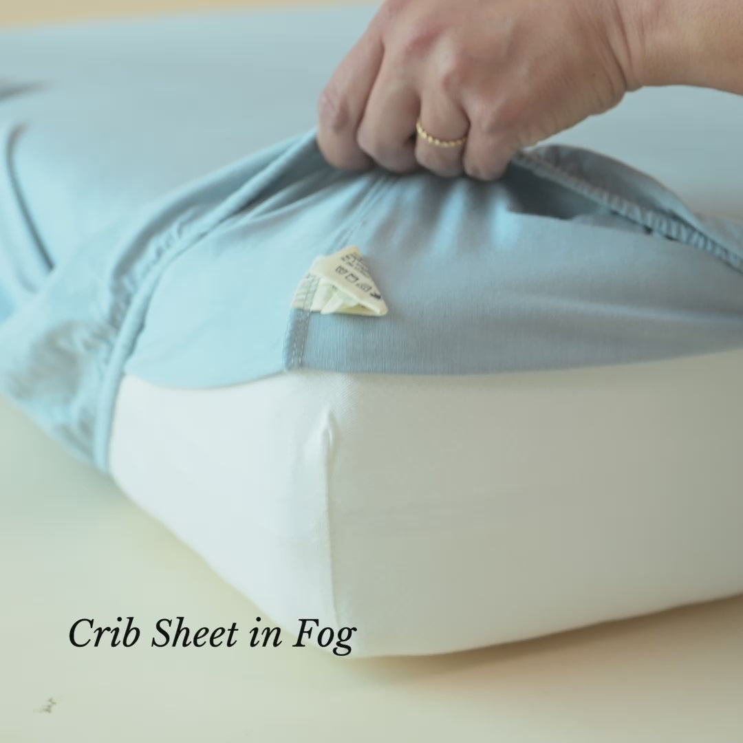 Video of crib sheet in Fog being put on a mattress