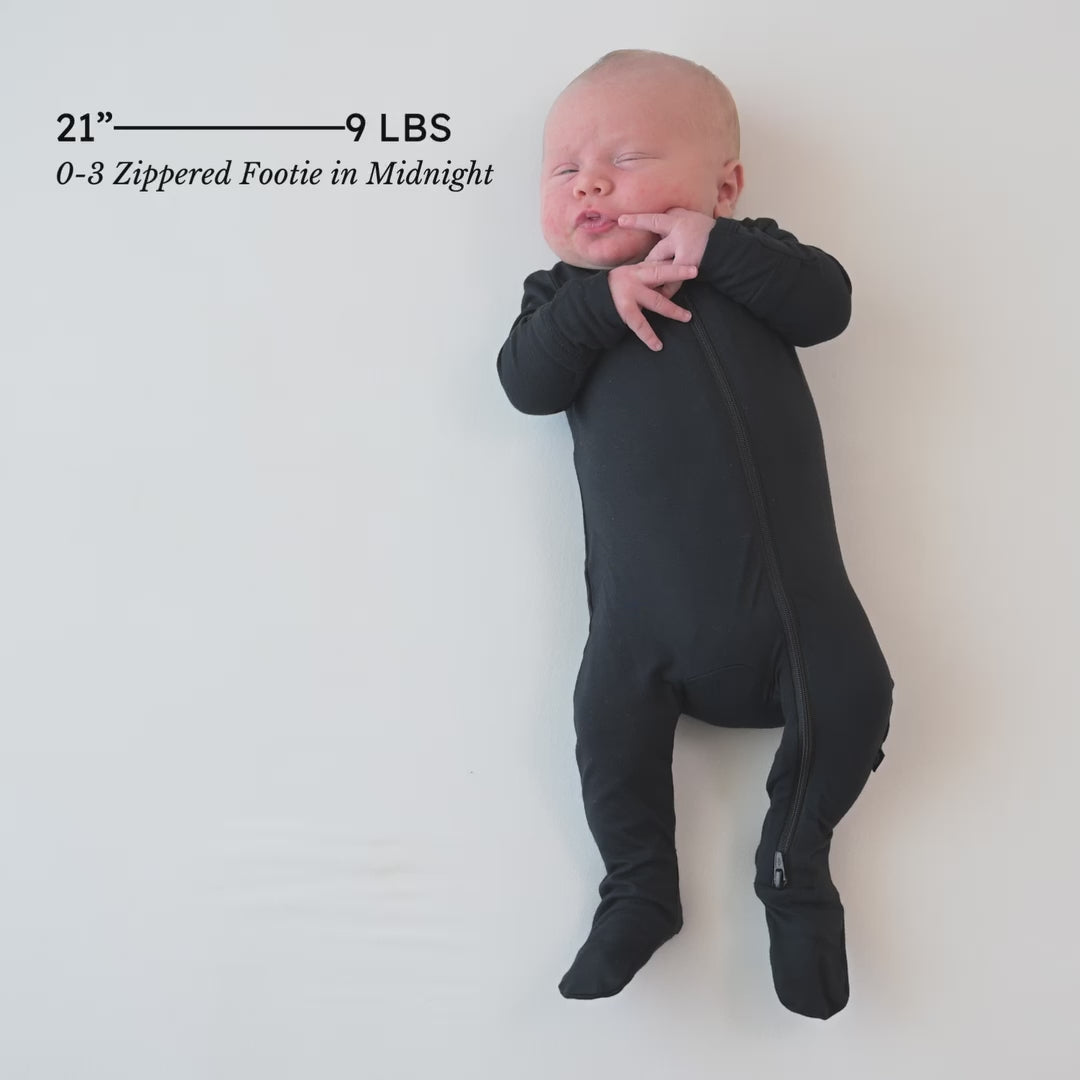 Video of newborn wearing the Zippered Footie in Midnight