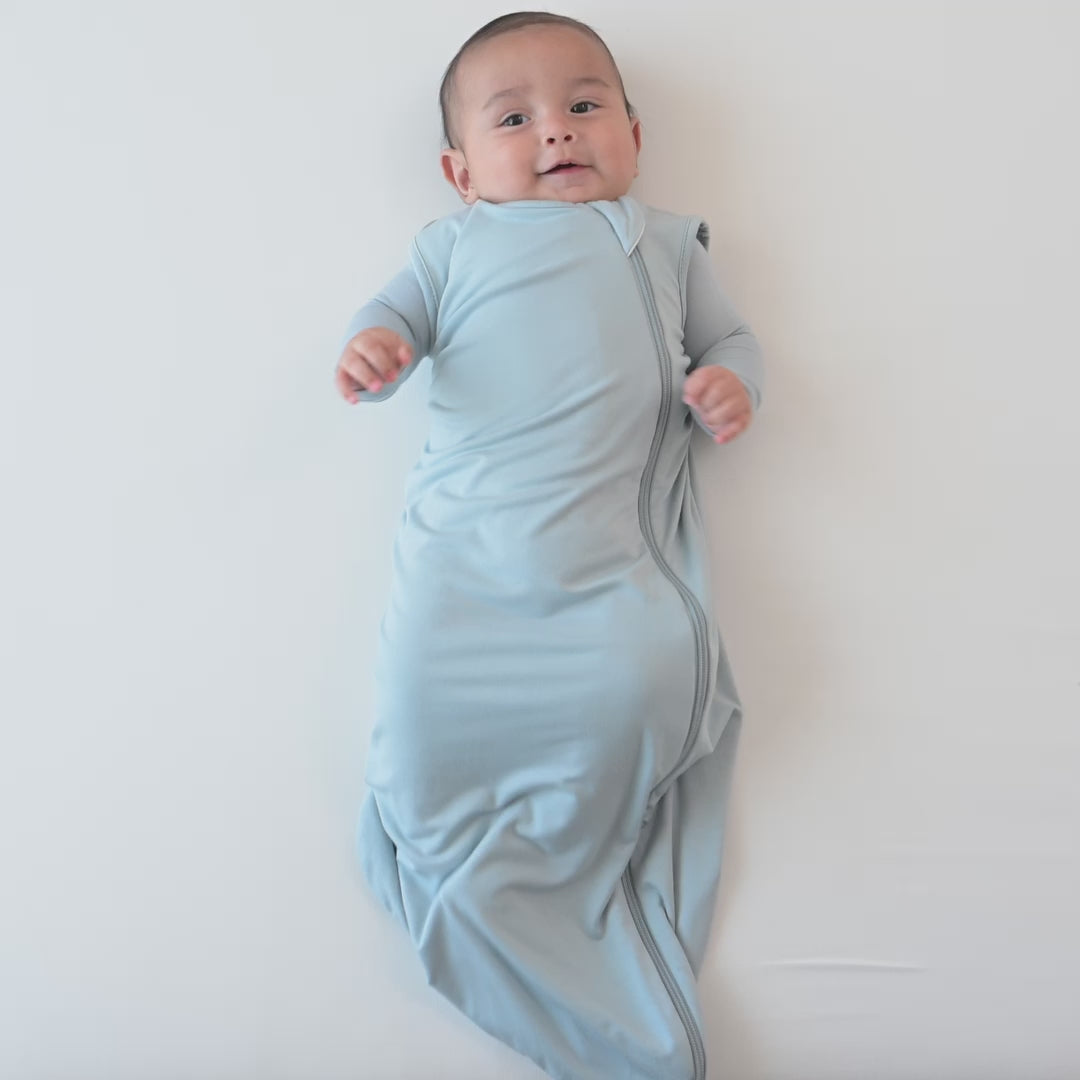 Video of an infant model wearing the 0.5 Tog Sleep Bag in Fog