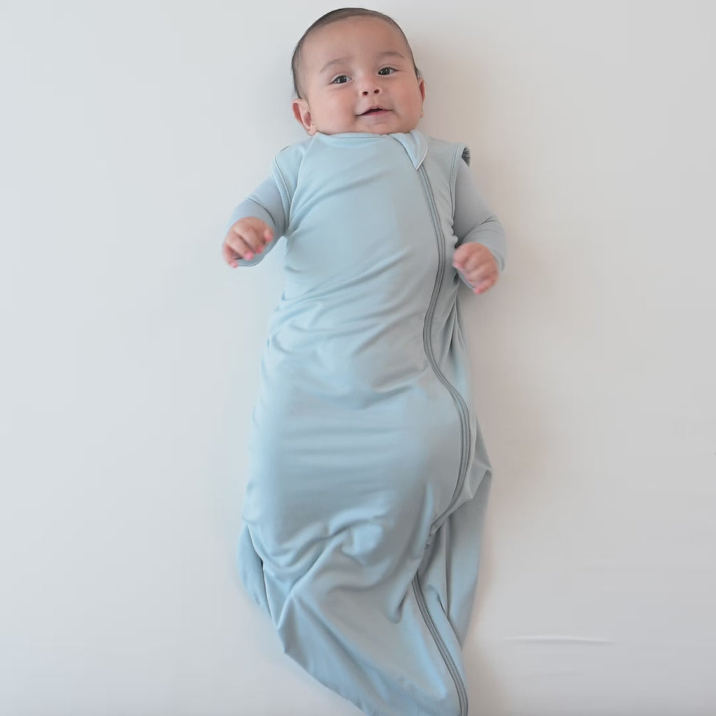 Video of an infant model wearing the 0.5 Tog Sleep Bag in Fog