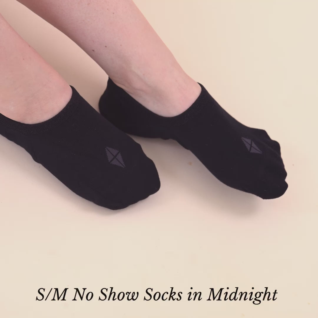 Video of Woman wearing Kyte Baby Women's No Show Socks in Midnight Black