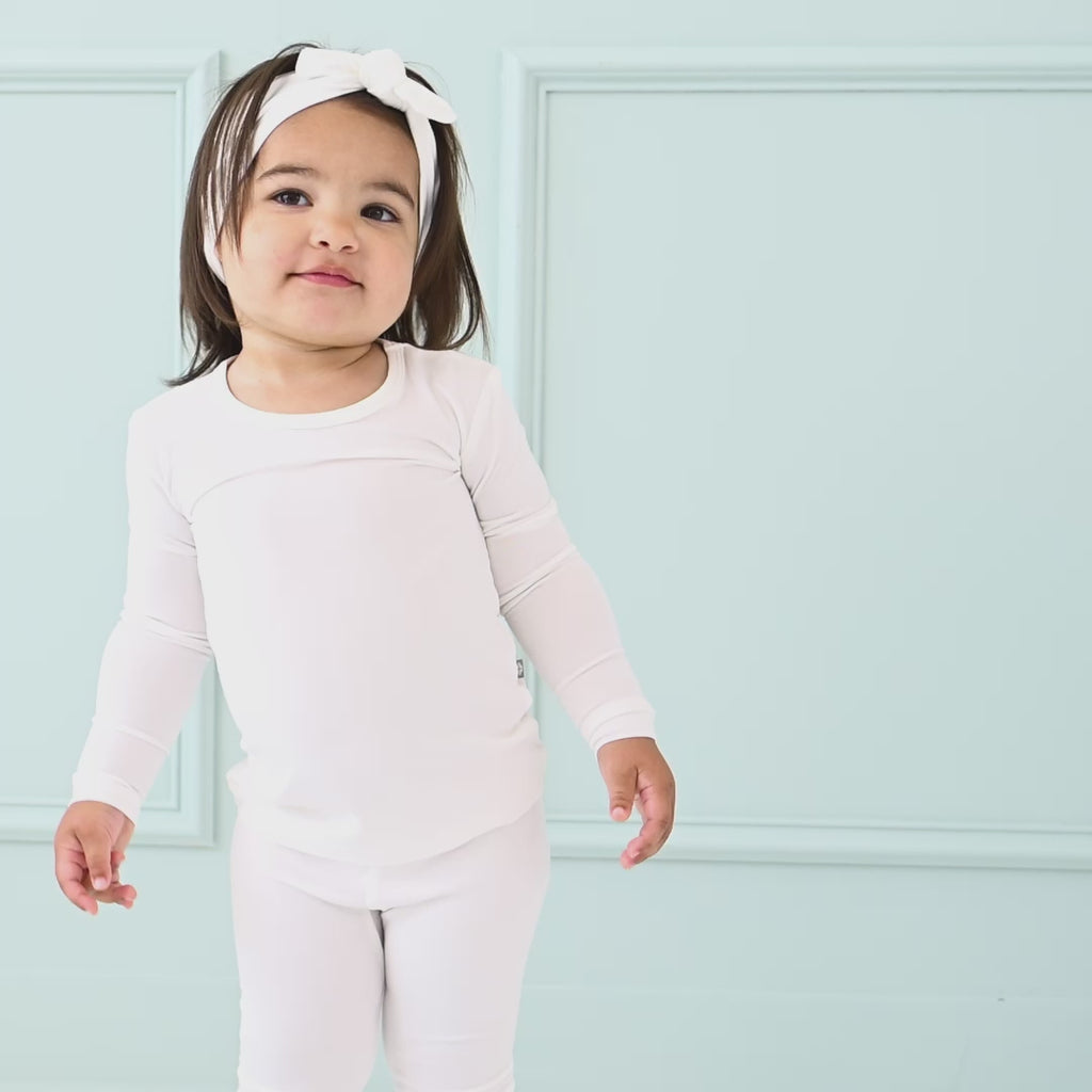 Video of Toddler wearing white Long Sleeve Pajamas